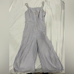 Blue and white striped jumpsuit. Minor stain on upper left side.#stripedjumpsuit